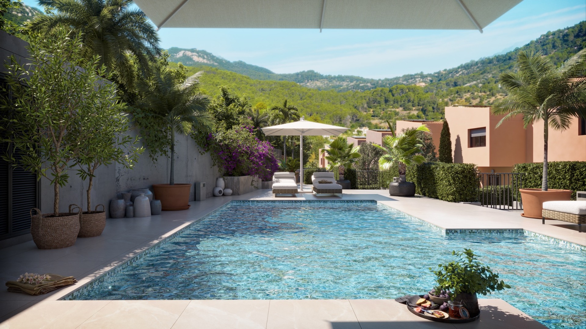 Basen osiedlowy z leżakami i zielenią w inwestycji ES Voltor w Esporles.