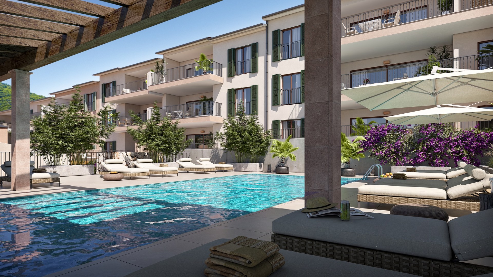 Basen w inwestycji Oli od Taylor Wimpey w Capdepera – leżaki i zieleń