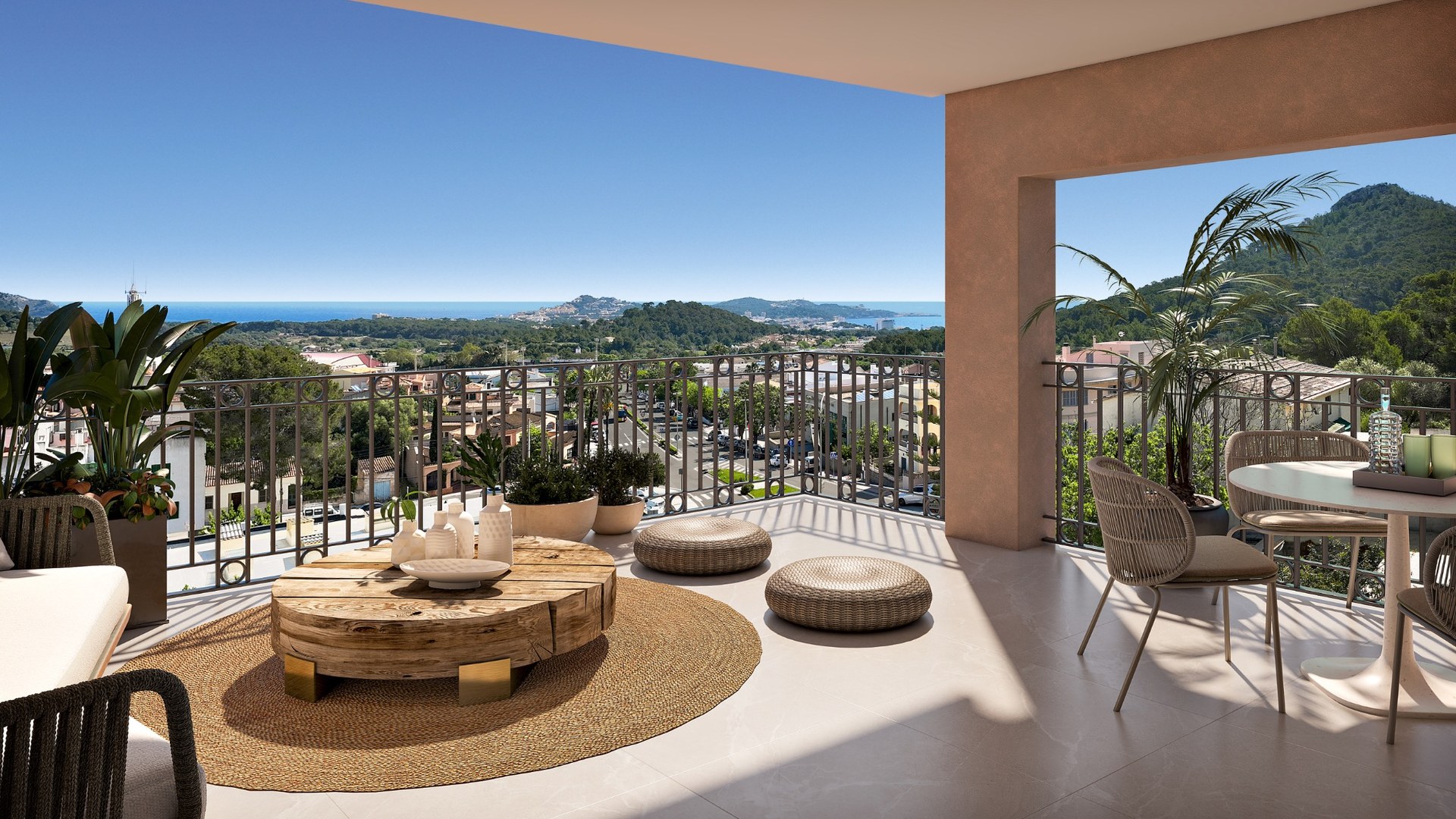 Taras w inwestycji Oli od Taylor Wimpey w Capdepera – szeroki widok na zatokę i okoliczną zieleń.