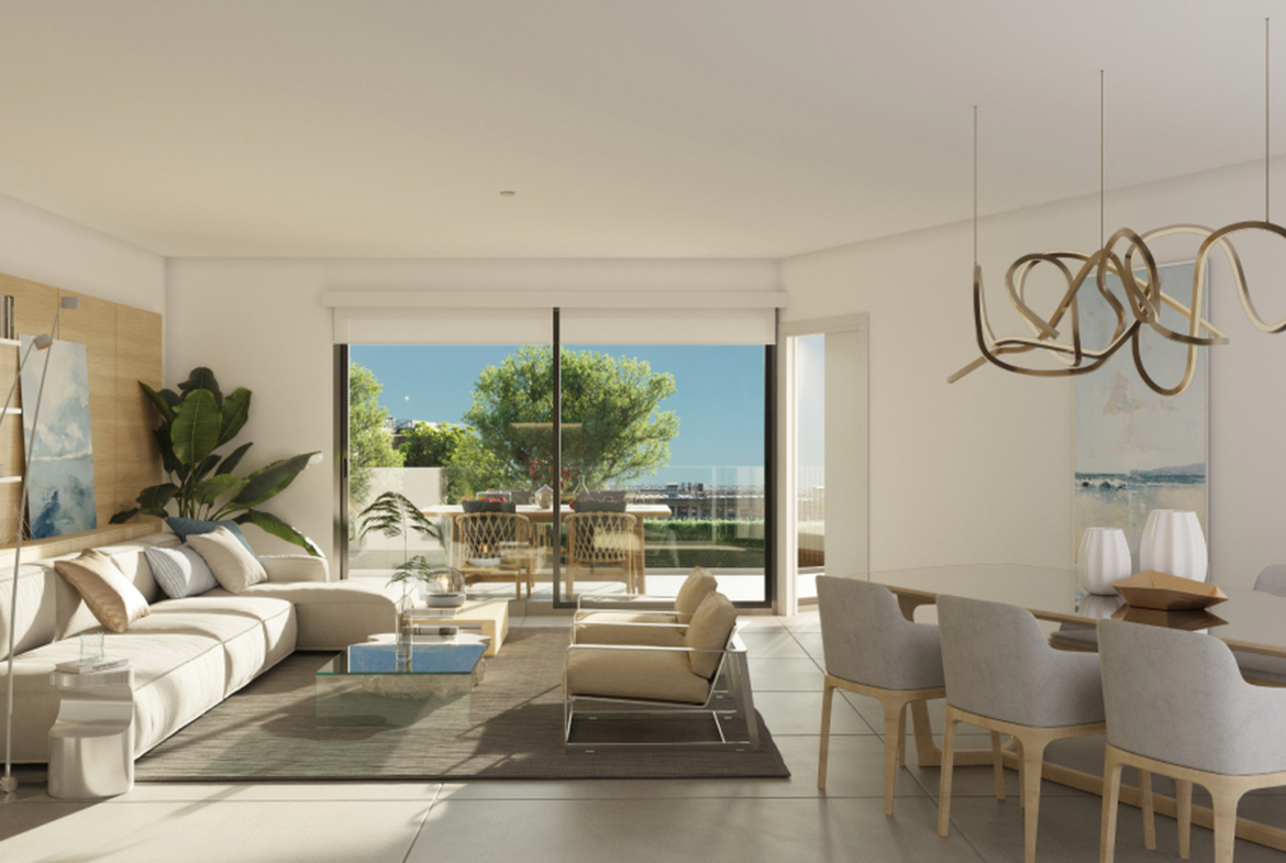 Jasny salon z jadalnią i wyjściem na taras.