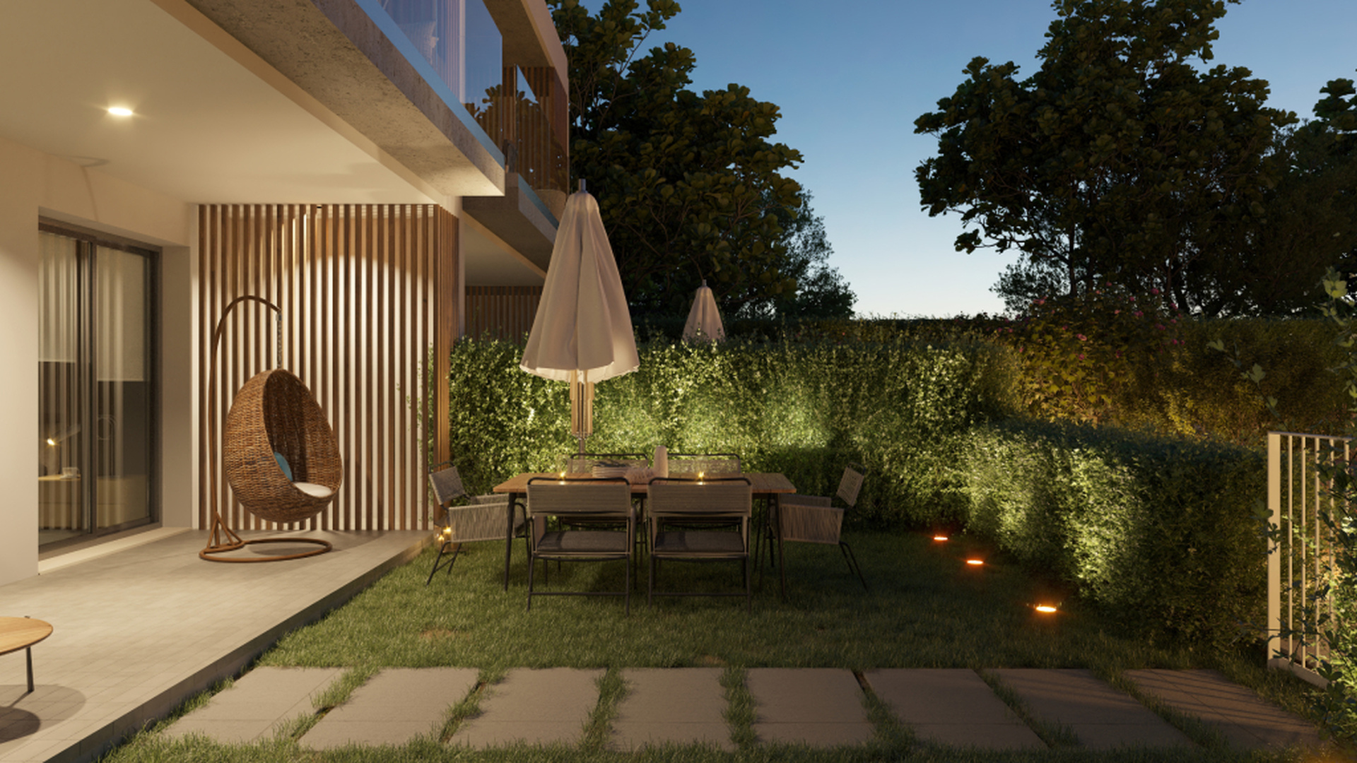 Prywatny taras ogrodowy z nastrojowym oświetleniem i strefą jadalnianą.